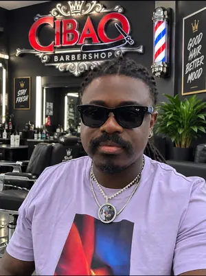Perla, barber at Cibao